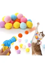 top atan kedi oyuncak tabancası ve ponpon toplar